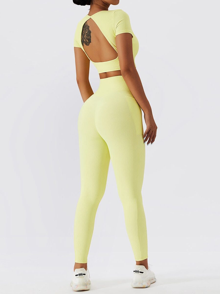 Fashionistas Dream: Open-Back Ribbed Short-Sleeve Crop Top & High-Waist Pocketed Leggings Set for Women