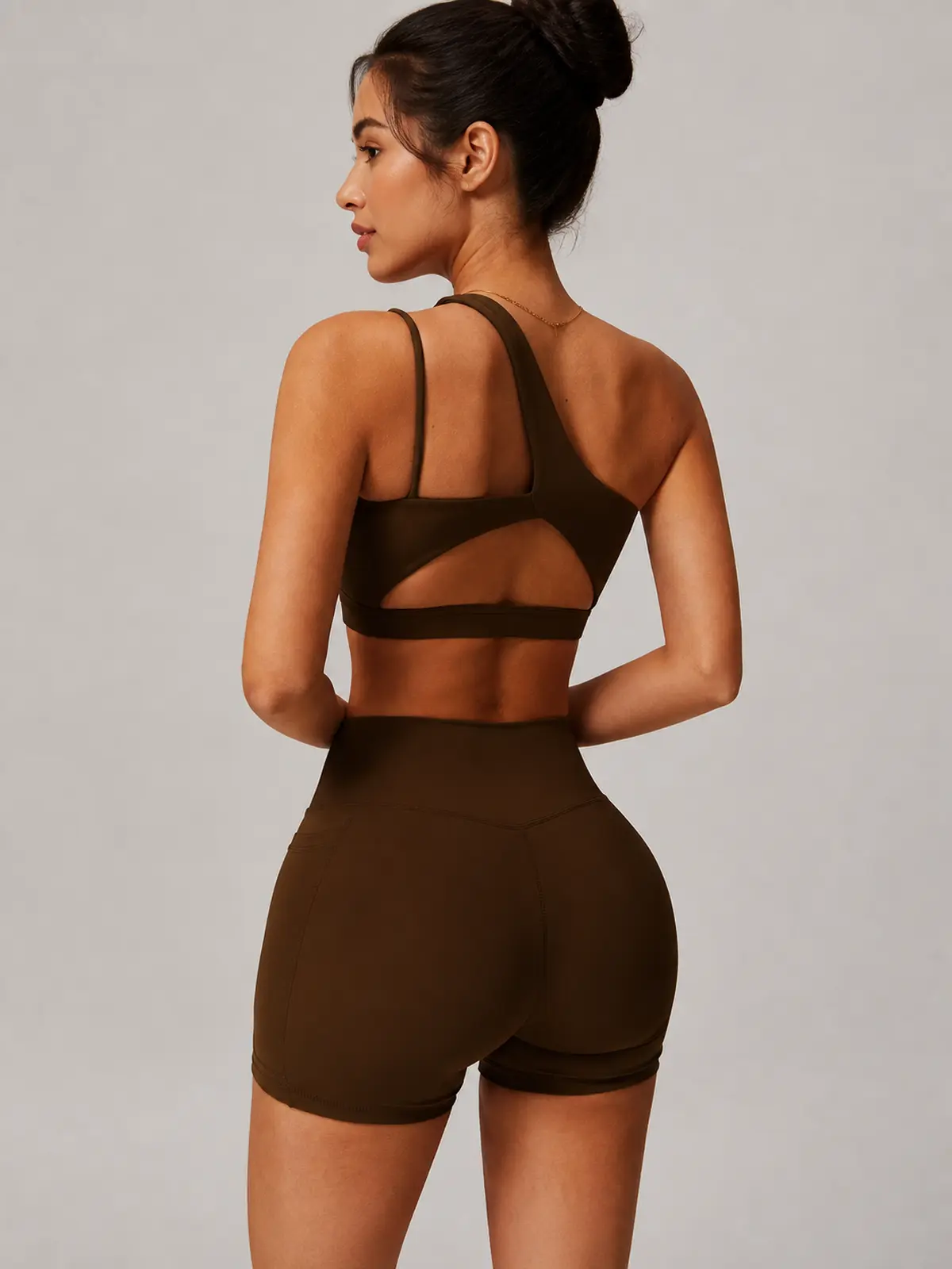 Asymmetry Edit One-Shoulder Cutout Sports Bra — brown — general — authoritative variation match