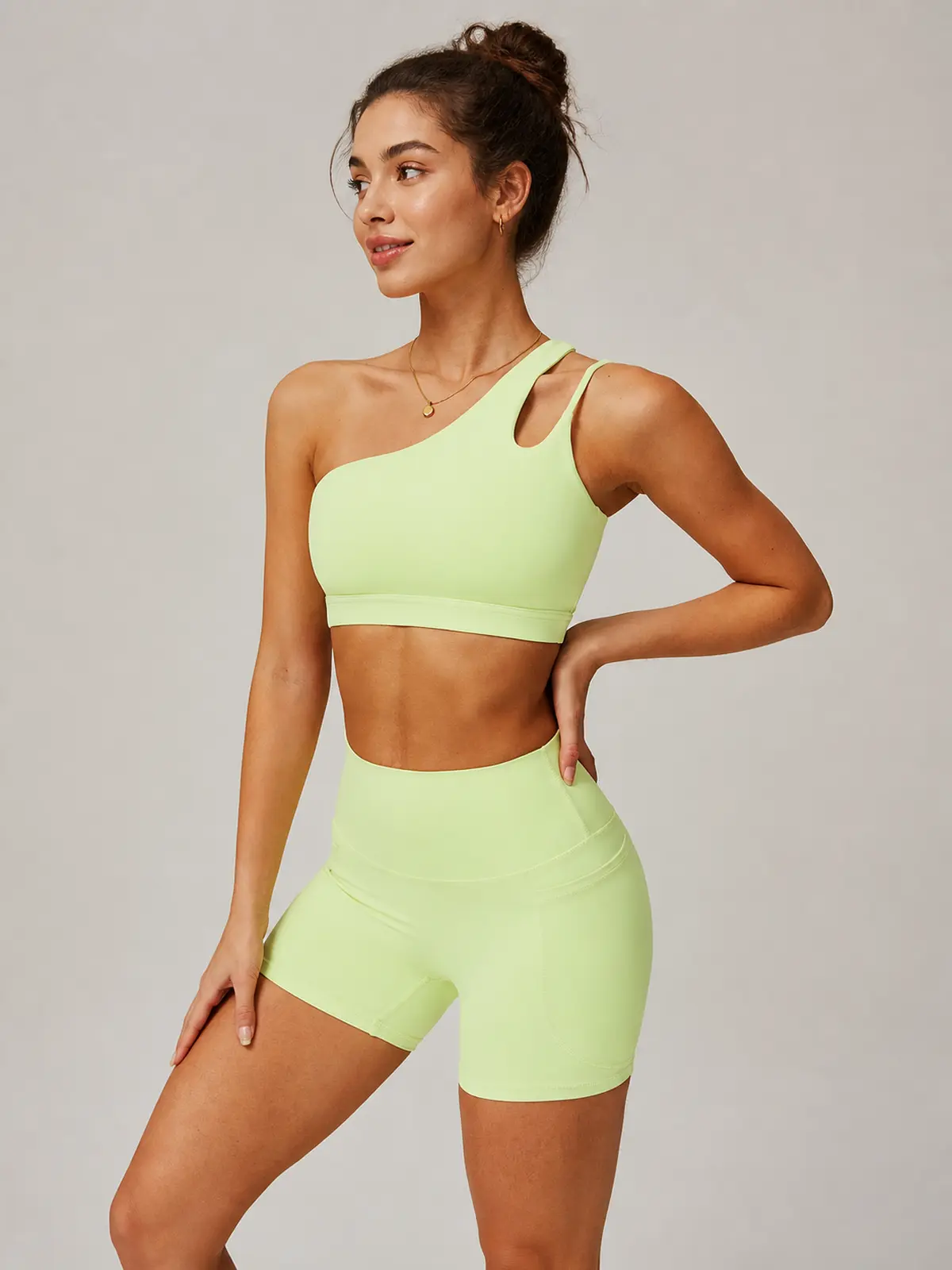 Asymmetry Edit One-Shoulder Cutout Sports Bra — pale yellow-green — general — authoritative variation match