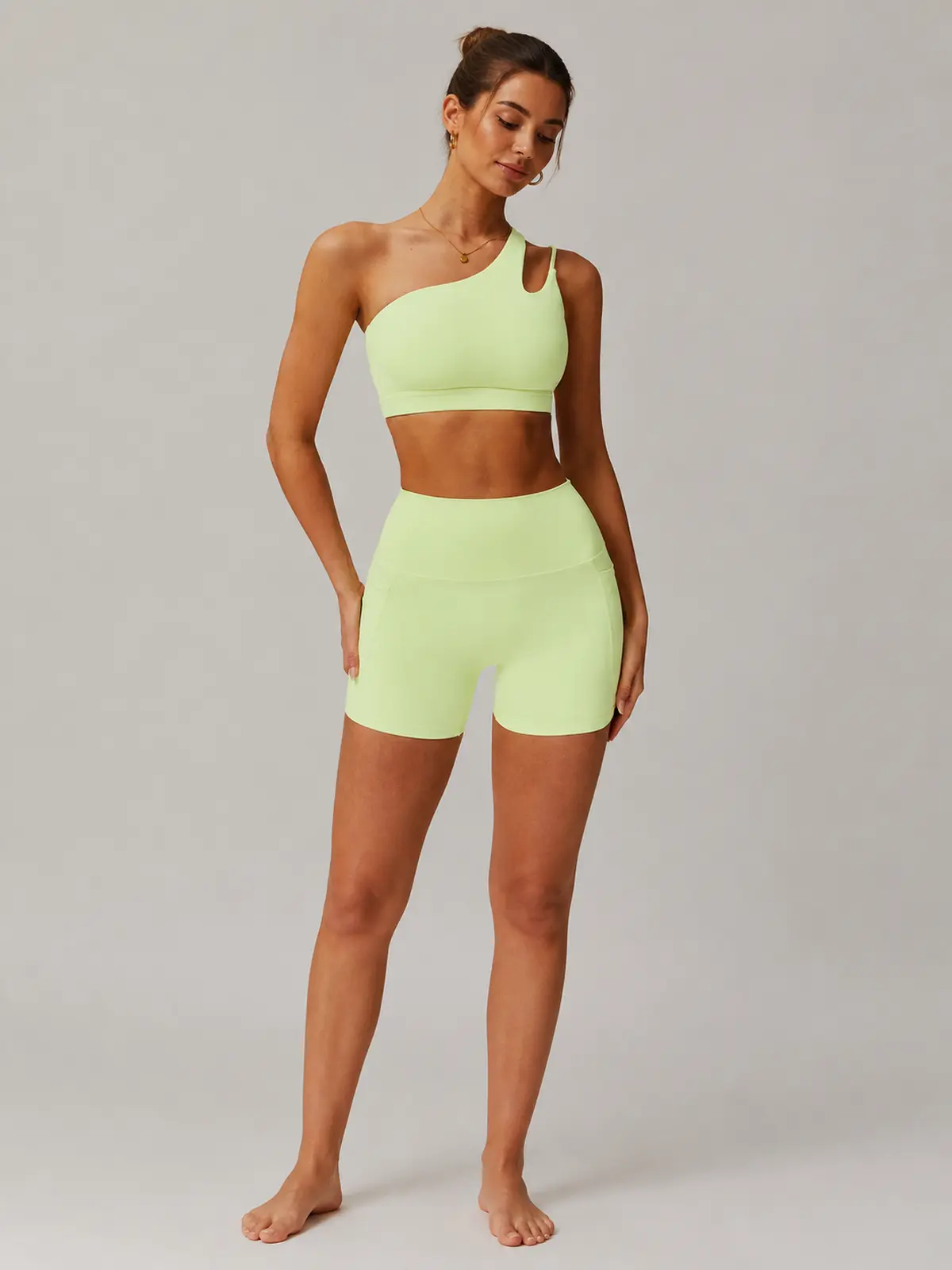 Asymmetry Edit One-Shoulder Cutout Sports Bra — pale yellow-green — general — authoritative variation match