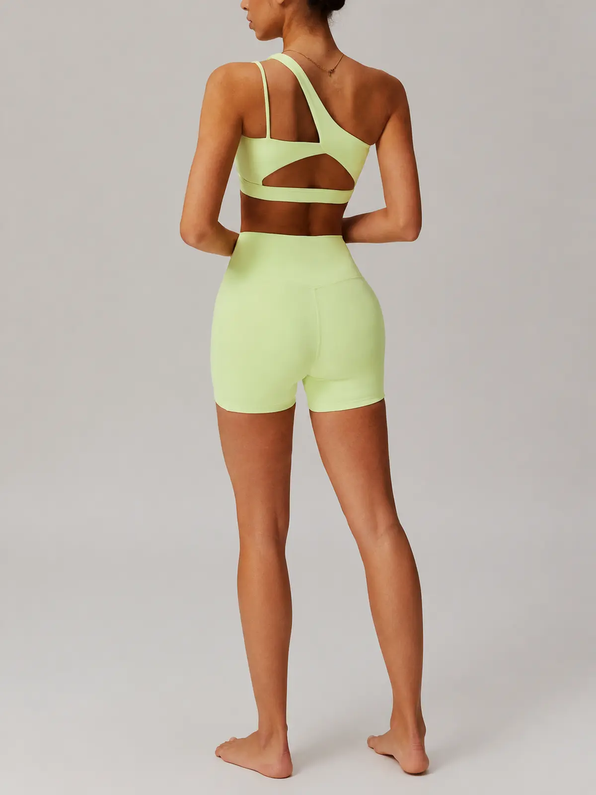 Asymmetry Edit One-Shoulder Cutout Sports Bra — pale yellow-green — general — authoritative variation match