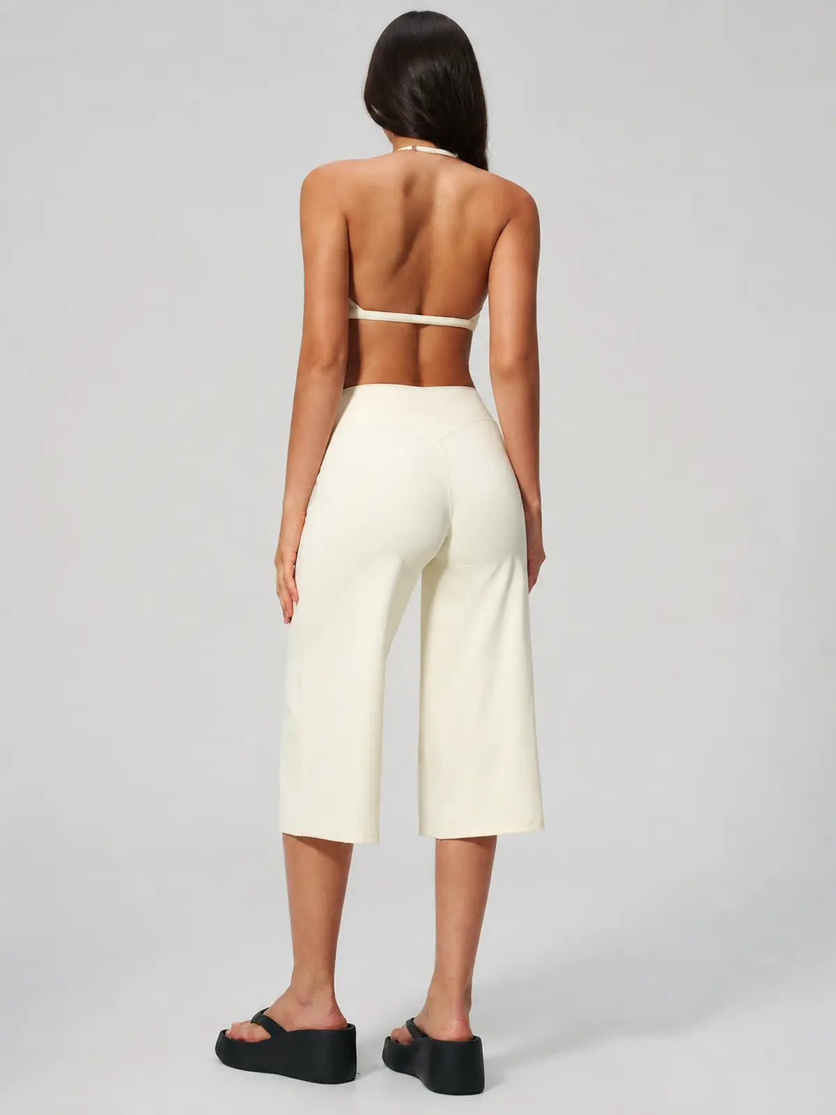 Citrine Note Halter Sports Bra and Capri Leggings Set — studio portrait