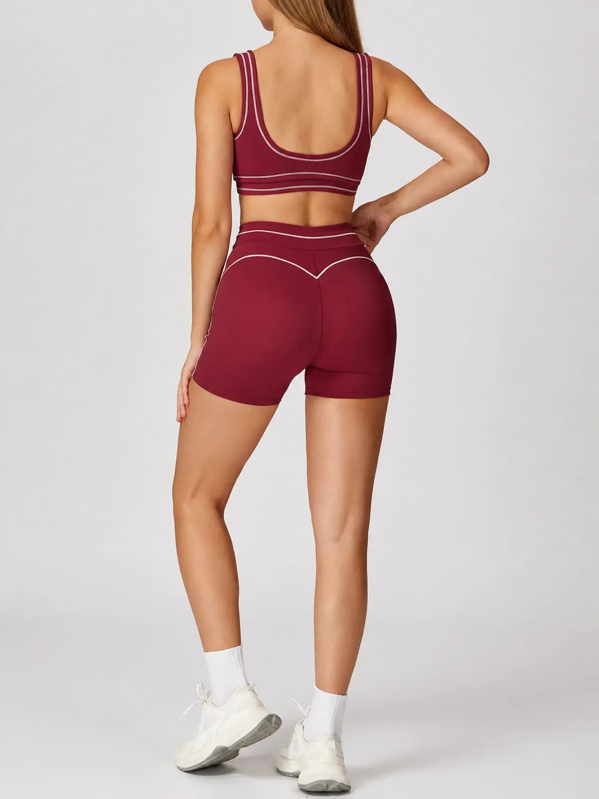 Contrast Rhythm Scoop-Neck Contrast-Trim Sports Bra — burgundy red with pale pink contrast piping — general — authoritative variation match