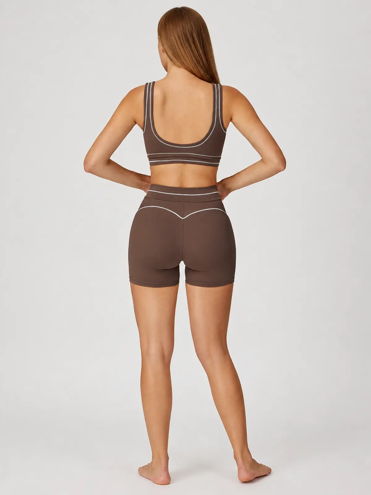 Contrast Rhythm Scoop-Neck Contrast-Trim Sports Bra — dark chocolate brown with light gray contrast piping — general — authoritative variation match