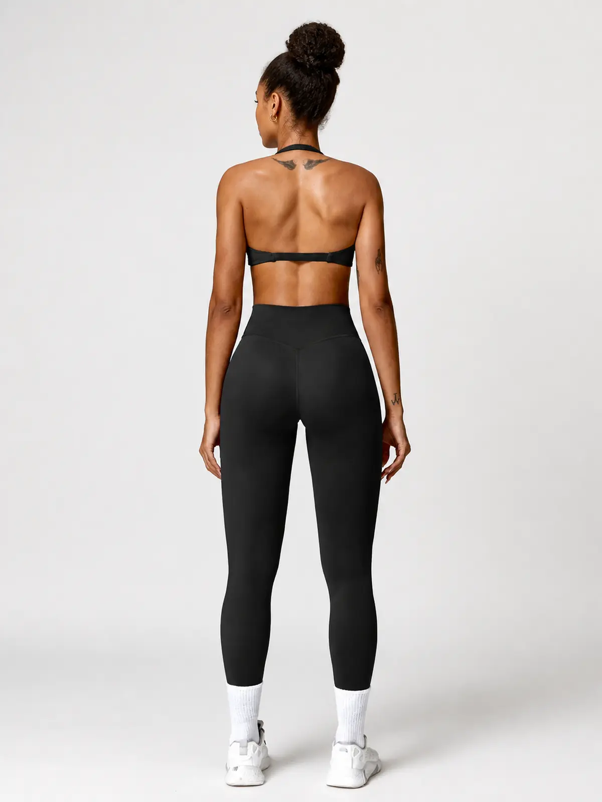 Marina Halo Twist-Front Halter Sports Bra — black — general — assigned human anchor cluster