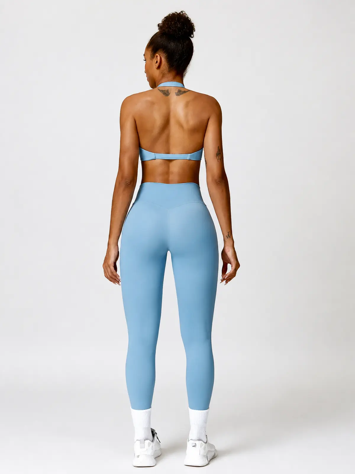Marina Halo Twist-Front Halter Sports Bra — haze blue — general — authoritative variation match