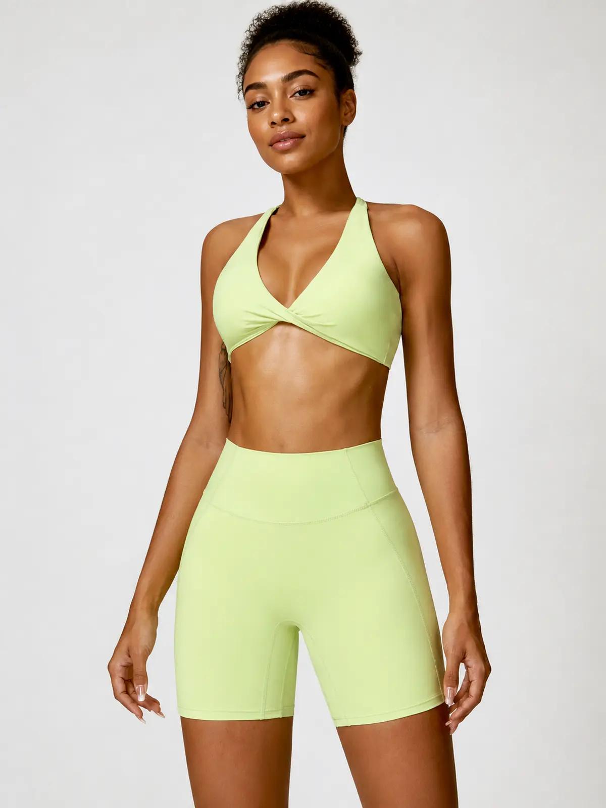 Marina Halo Twist-Front Halter Sports Bra — light yellow green — general — authoritative variation match