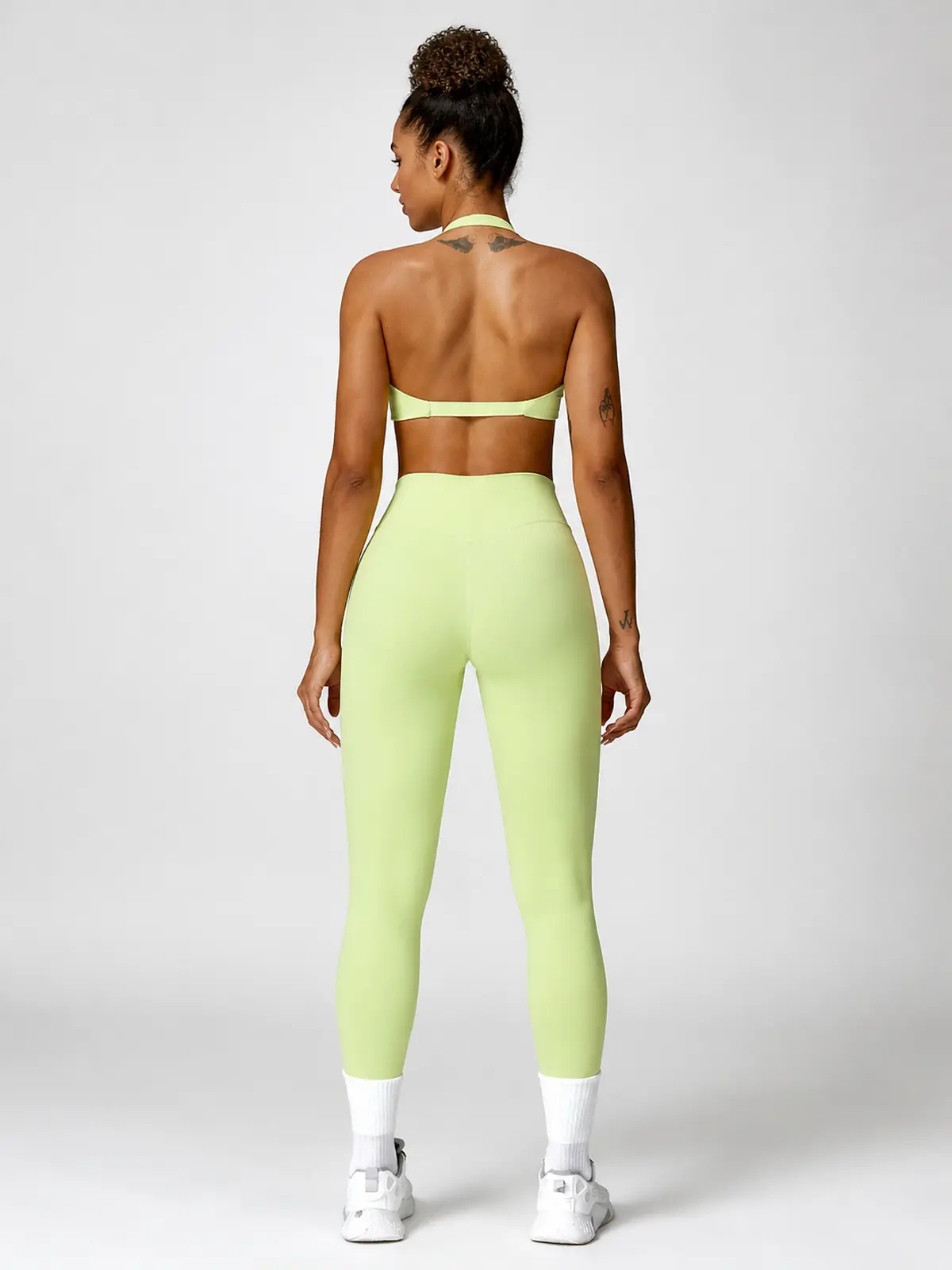 Marina Halo Twist-Front Halter Sports Bra — light yellow green — general — authoritative variation match
