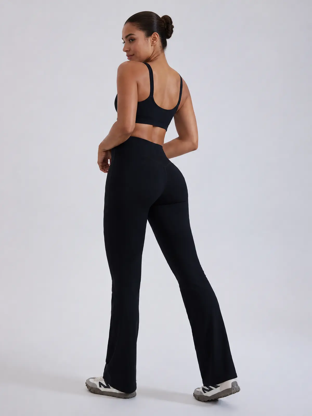 Mosaic Dawn Twist-Waist Flare Leggings — black — flare-leggings — authoritative variation match