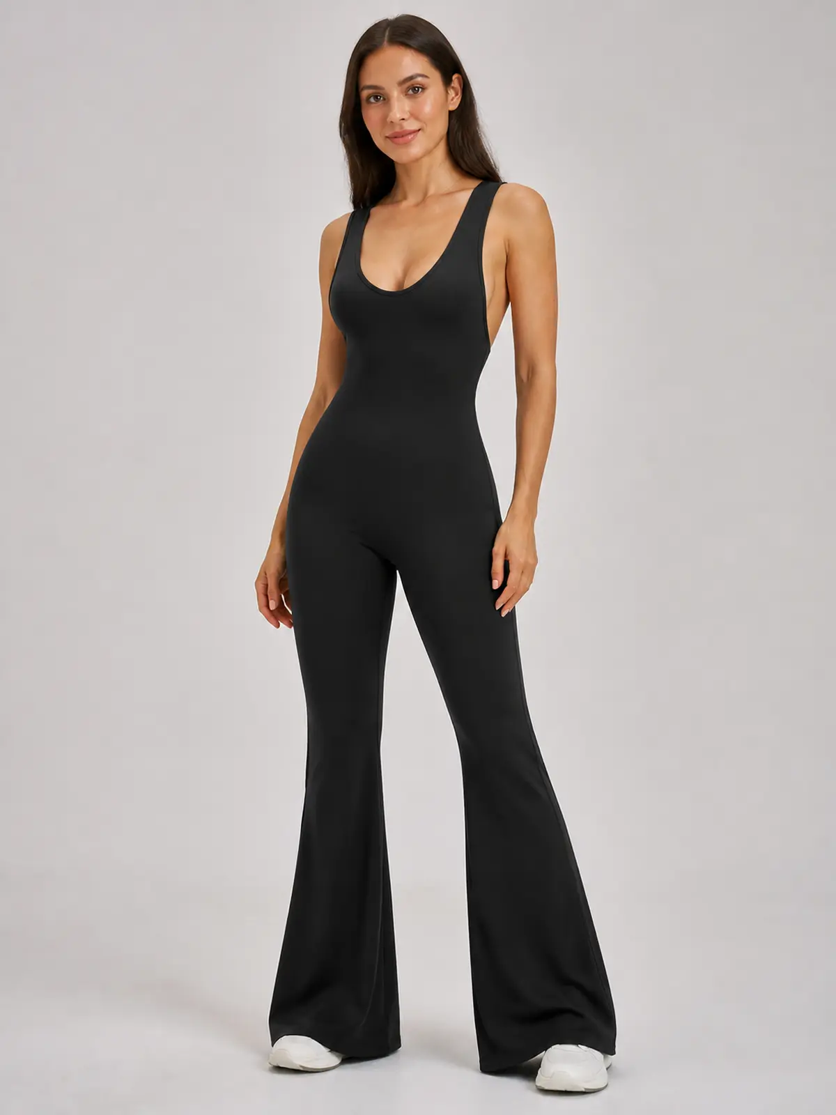 Vesper Arc Sleeveless Flared-Leg Yoga Jumpsuit — black — authoritative variation match