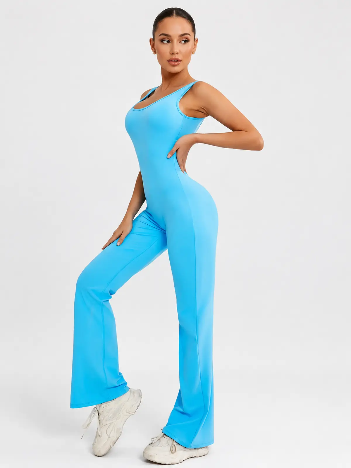 Pavilion Drift Sleeveless Open-Back Flared-Leg Yoga Jumpsuit — bright turquoise blue — authoritative variation match