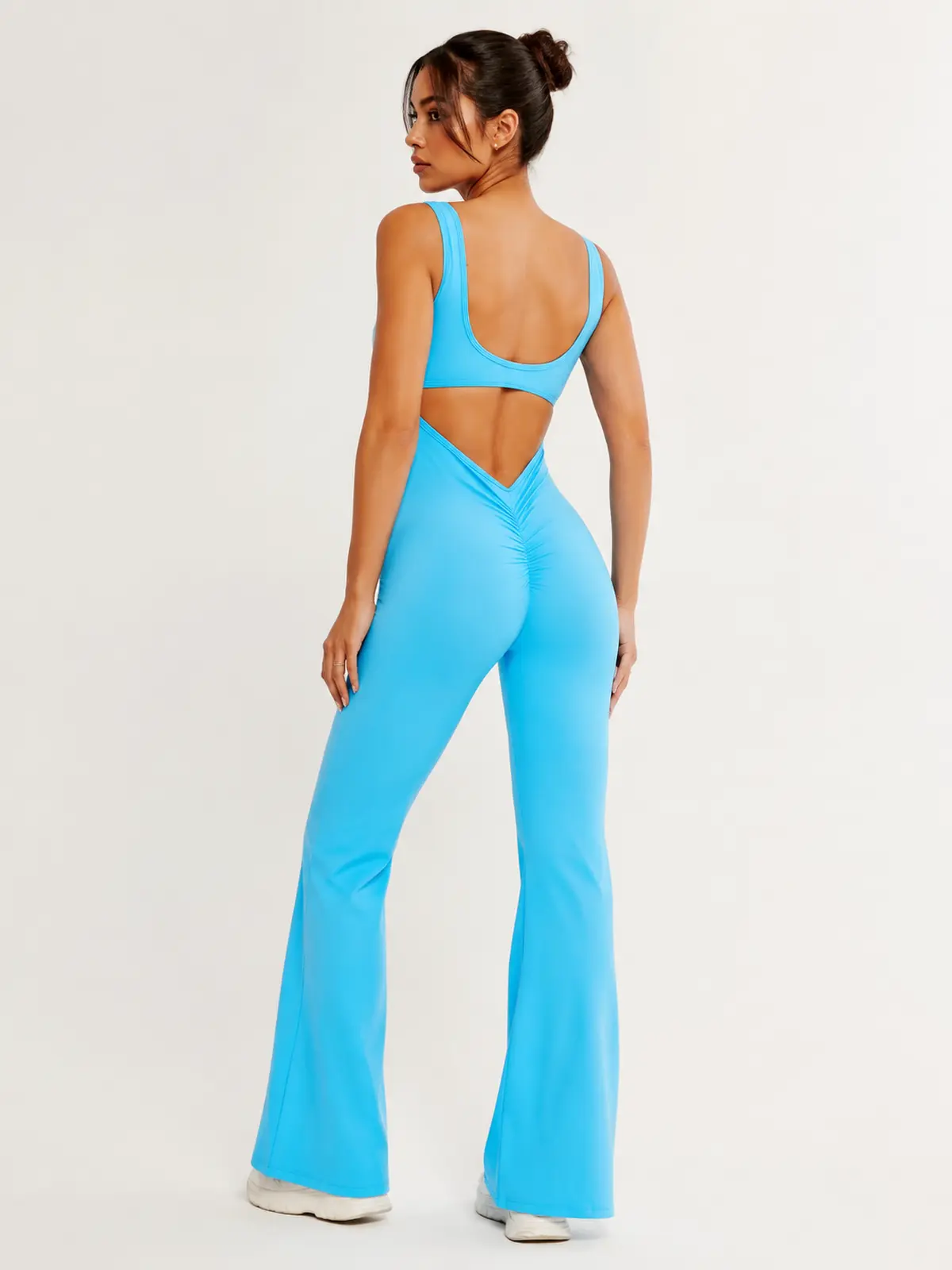 Pavilion Drift Sleeveless Open-Back Flared-Leg Yoga Jumpsuit — bright turquoise blue — authoritative variation match
