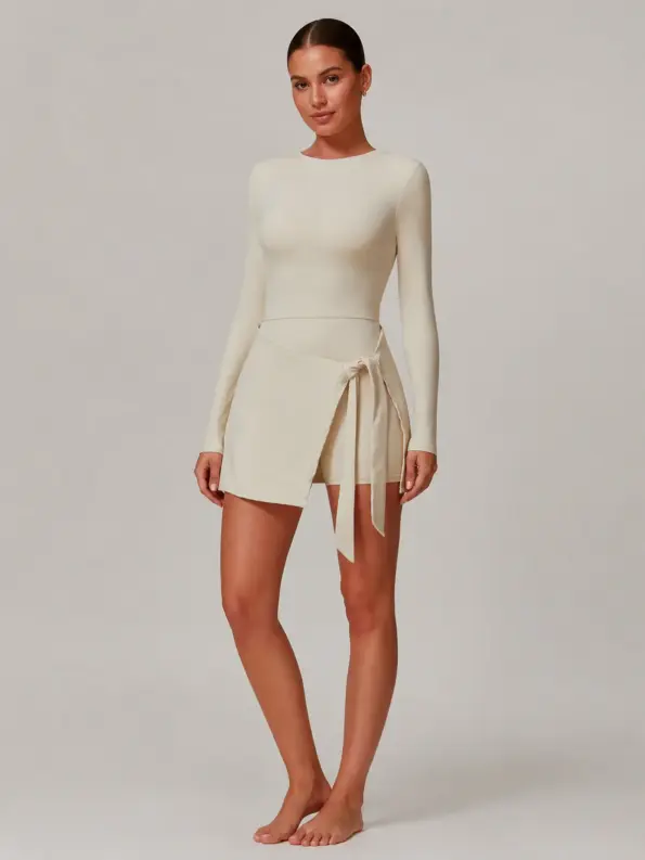 Wrapline Motion Long-Sleeve Wrap-Skirt Yoga Romper — light beige — exercise-dress — authoritative variation match