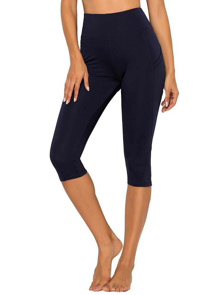 Dynamic Ashtanga Movement High-Rise Yoga Capris with Pockets - Perfect for Flowing Stretches and Poses.