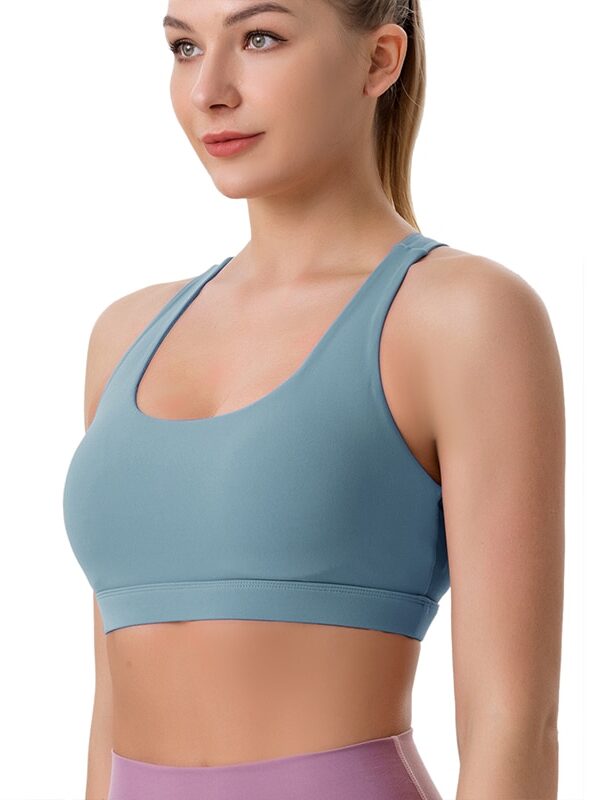 Stay Comfortable and Confident in this High-Performance Essentia Caliber Padded Racerback Sports Bra - Perfect for Running, Yoga, and Other Activities!