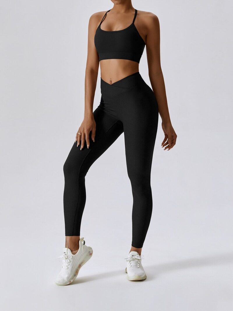 Experience Comfort and Style with this Ribbed Spaghetti Strap Sports Bra and Elastic V-Waist Leggings Set - Perfect for Working Out or Lounging in Luxury.