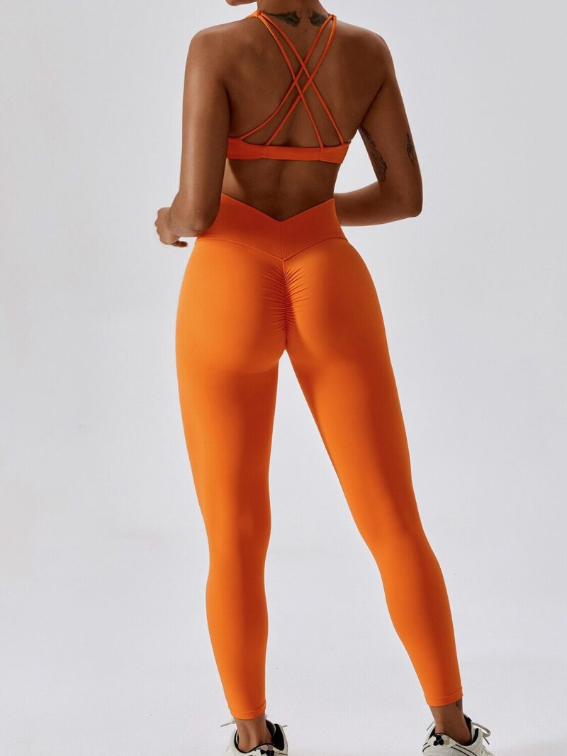 Look and Feel Your Best with the Criss-Cross Twist Front Sports Bra & V-Waist Scrunch Butt Leggings Set! Get Ready to Sweat in Style and Comfort with This Stylish Athletic Wear.