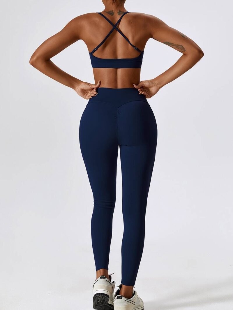 Look & Feel Fabulous in this Workout Outfit Set! Cross Back Sports Bra & High Waist Scrunch Butt Leggings for a Stylish Exercise Look.