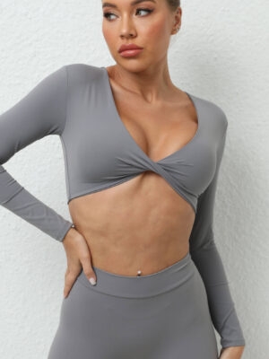 Sizzle in this Sexy Long-Sleeve Padded Yoga Crop Top - Twist for a Tempting Look!